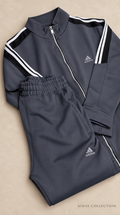 Ainas Collection charcoal shoulder stripe set — AI-assisted background edit of actual supplier video frame; confirm colour, size and availability
