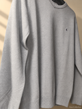 Ainas Collection grey crewneck knit sweater, actual cropped front photograph with edited background
